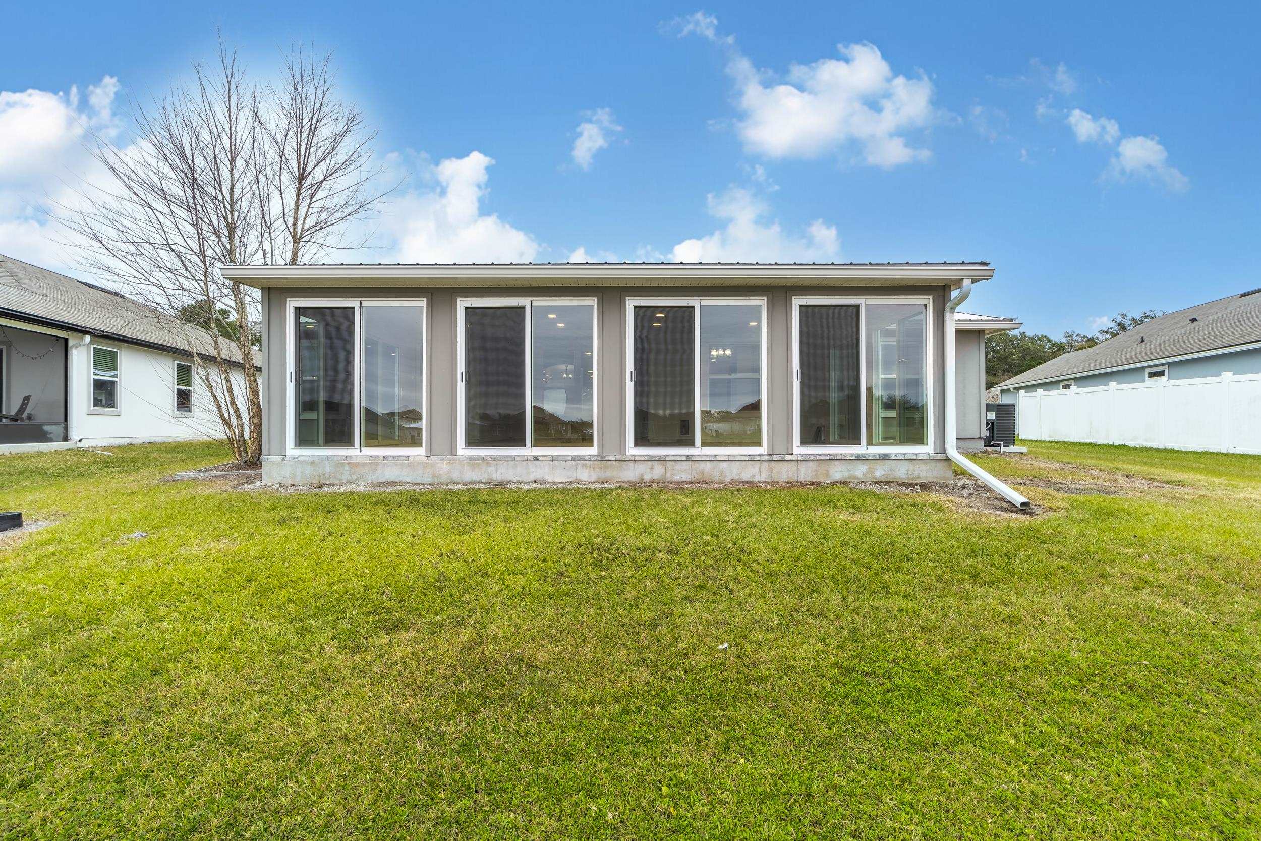 228 Fox Water Trail St. Augustine, FL 32086 - Photo 47 of 50 a view of a house with a backyard