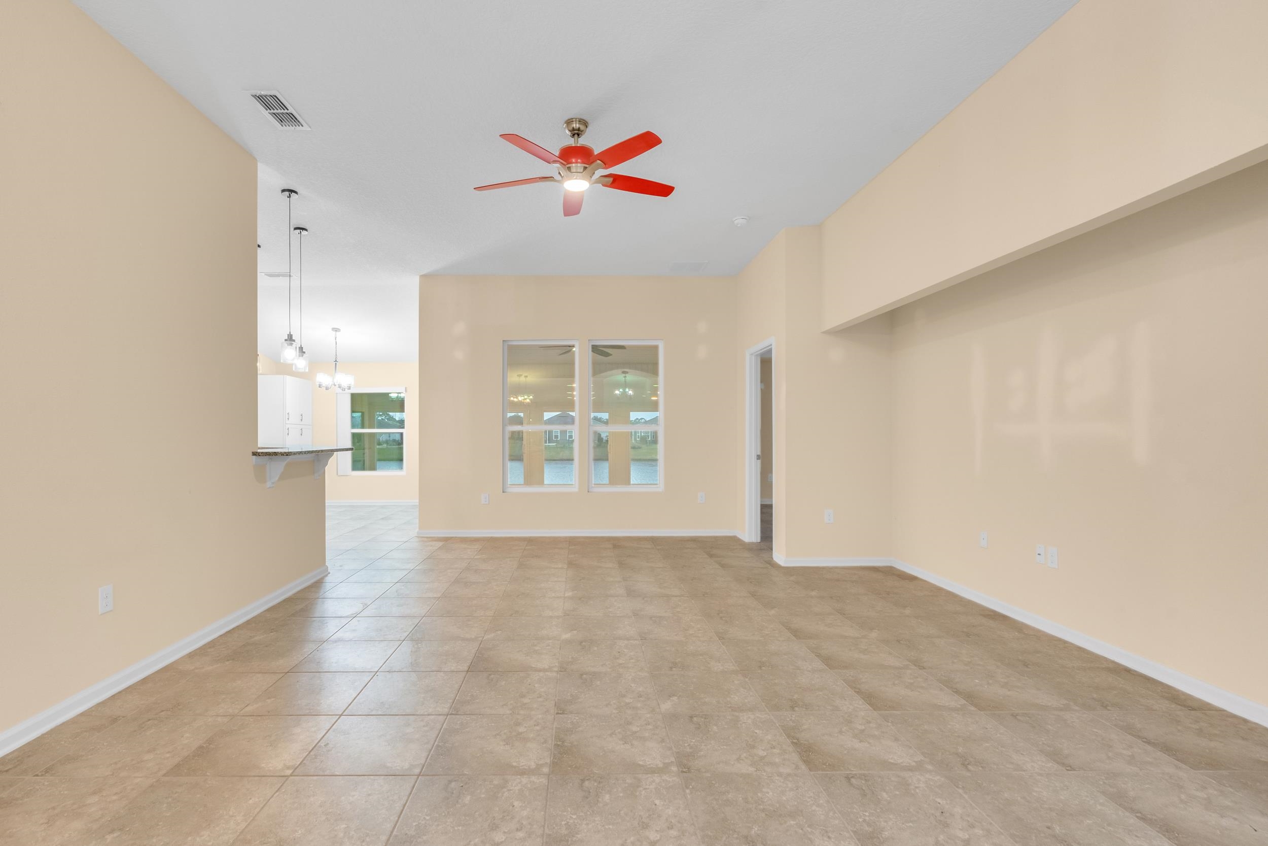 228 Fox Water Trail St. Augustine, FL 32086 - Photo 5 of 50 a view of an empty room with a window