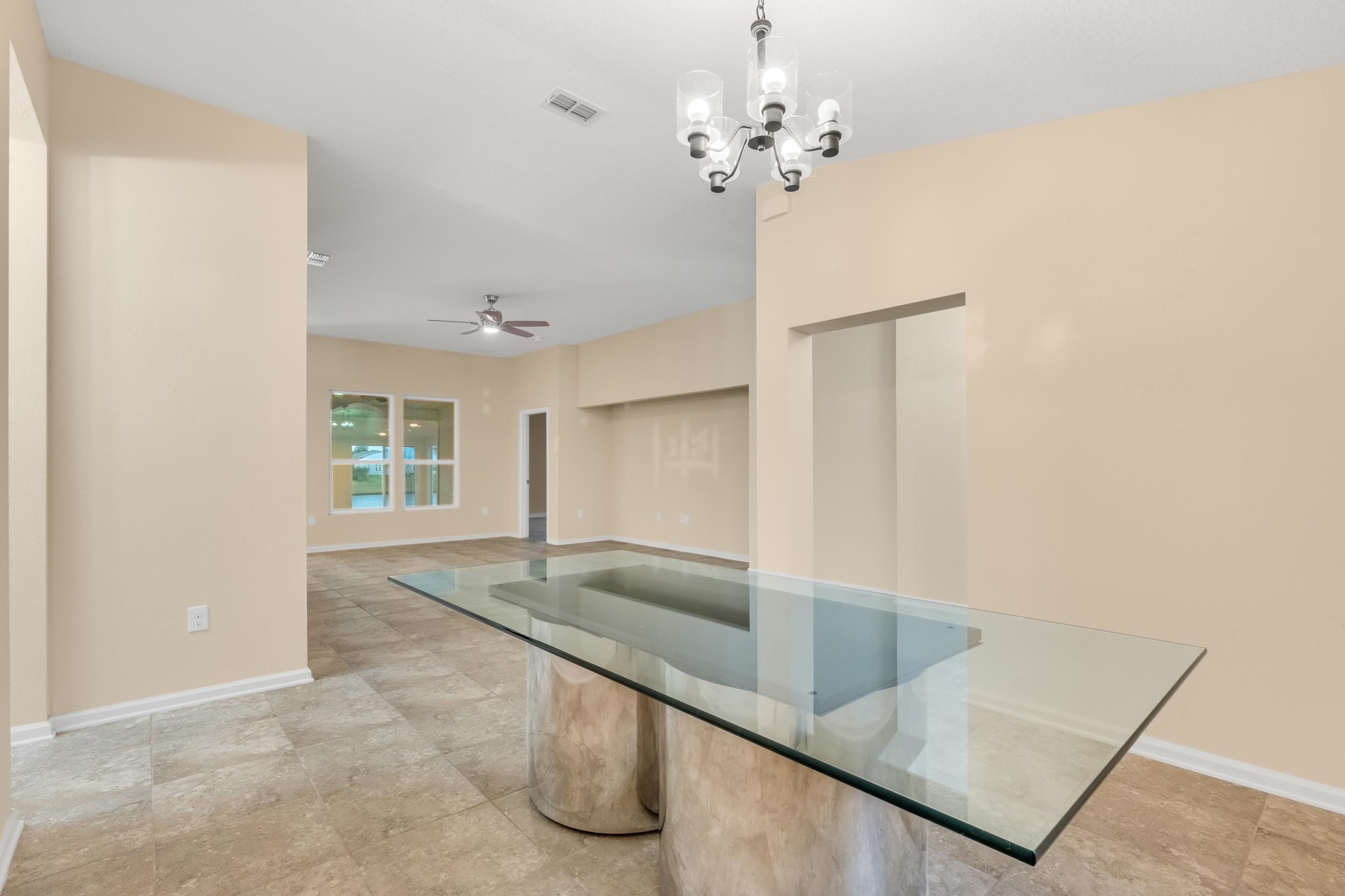 228 Fox Water Trail St. Augustine, FL 32086 - Photo 10 of 50 an empty room with windows