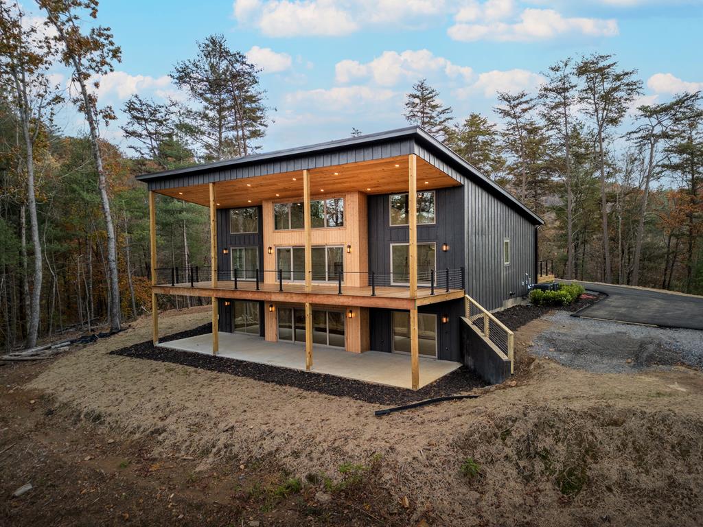 1713 Old Northcutt Road Ellijay, GA 30536 - Photo 1 of 45 a view of an house with backyard space and balcony