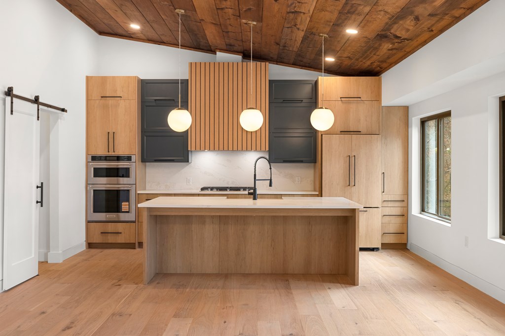 1713 Old Northcutt Road Ellijay, GA 30536 - Photo 19 of 45 a kitchen with a stove and a wooden floors