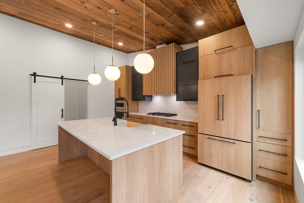 1713 Old Northcutt Road Ellijay, GA 30536 - Photo 21 of 45 a kitchen with a refrigerator a sink and cabinets