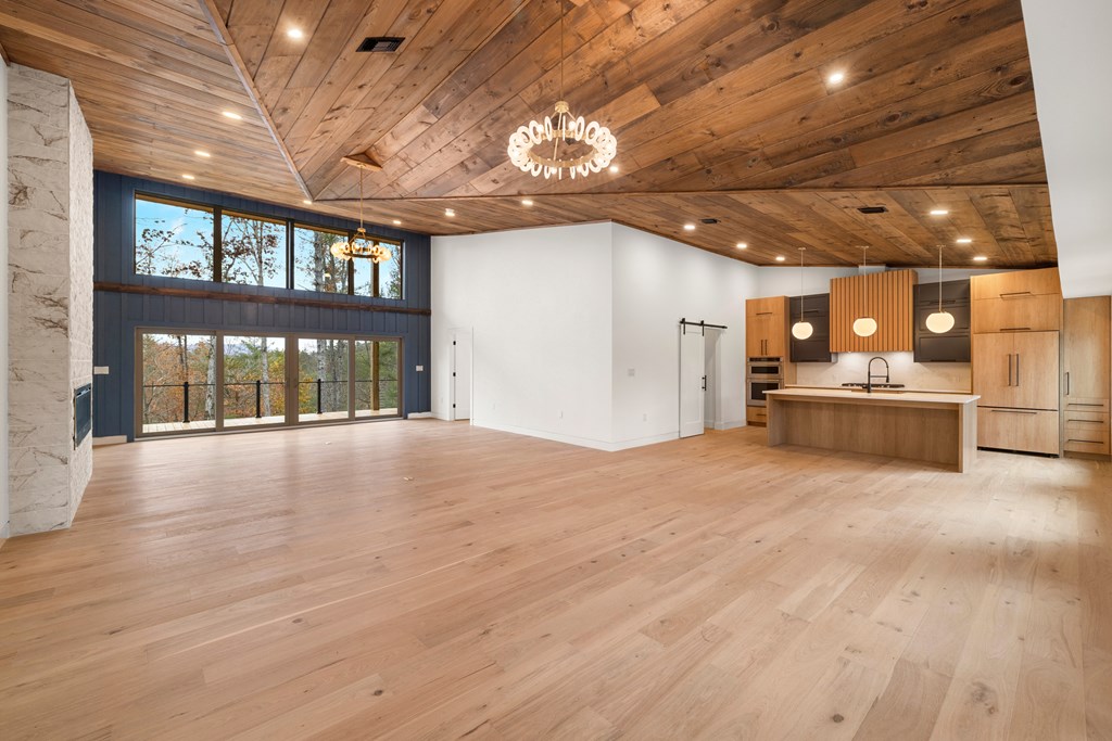 1713 Old Northcutt Road Ellijay, GA 30536 - Photo 6 of 45 a view of an empty room with a kitchen