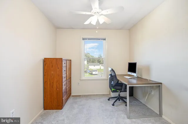 a workspace with furniture and a window