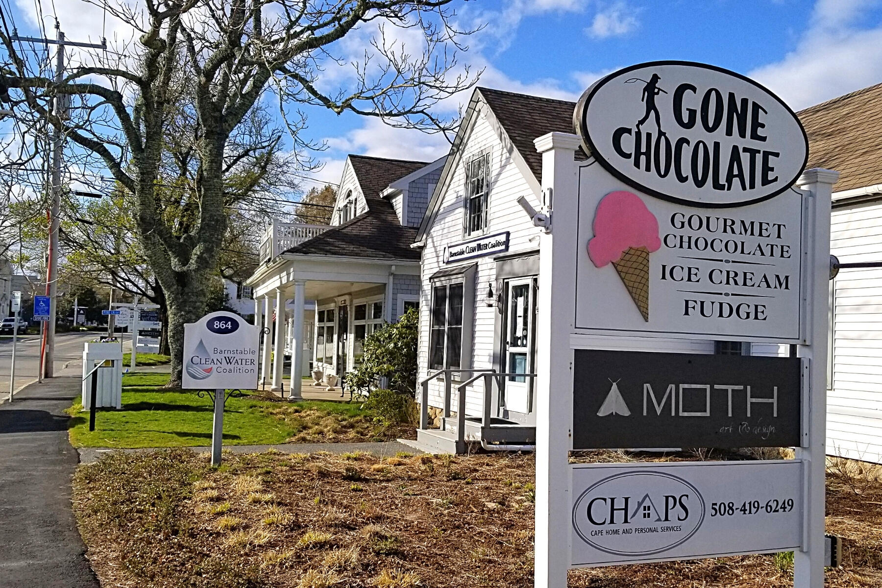 162 Main Street Osterville, MA 02655 - Photo 47 of 50 a sign on a brick building