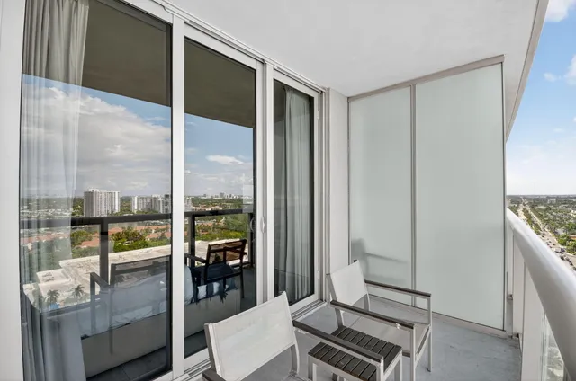 a view of a balcony with wooden floor
