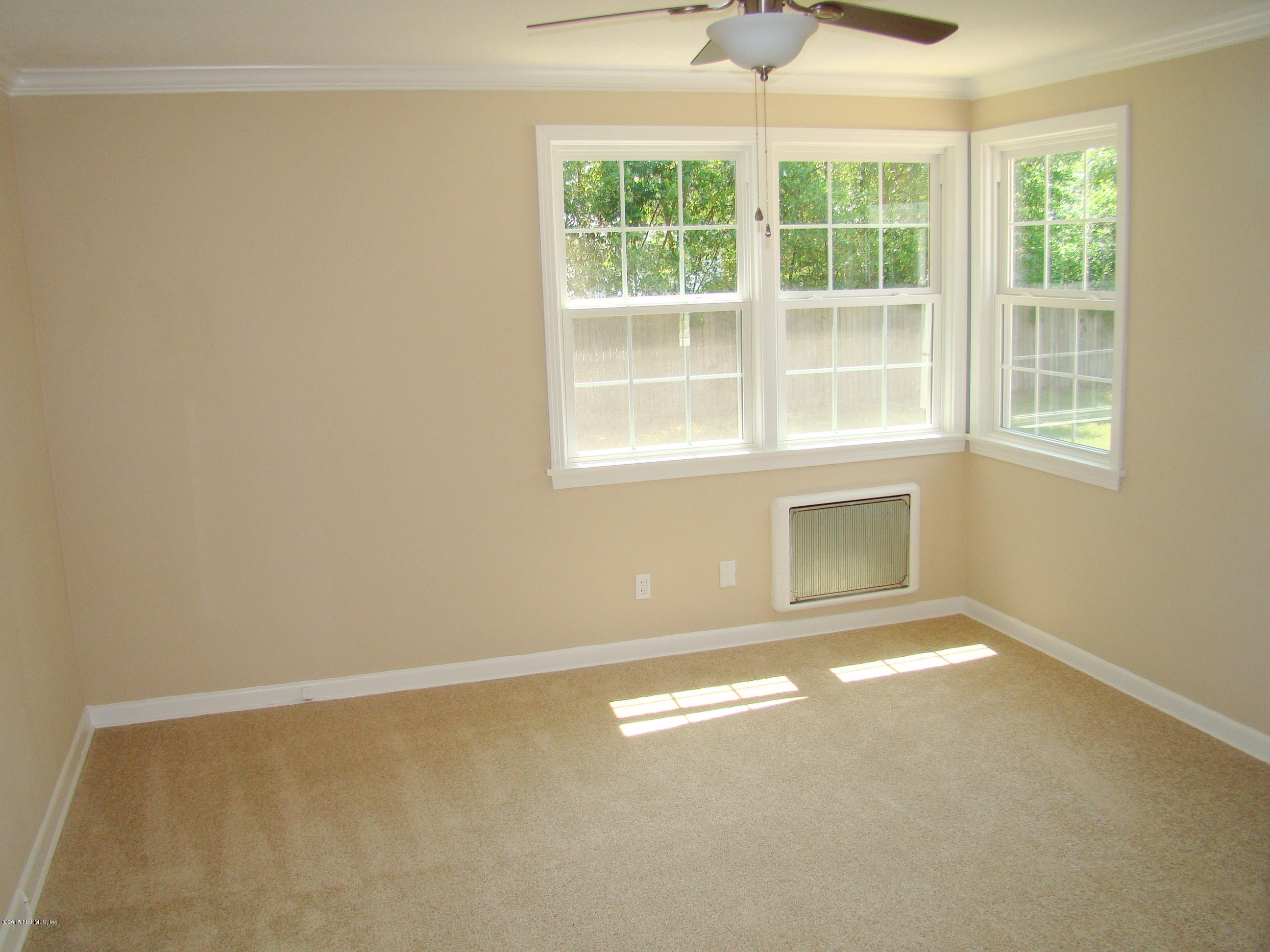 6315 Temple Road Jacksonville, FL 32217 - Photo 5 of 12 an empty room with windows