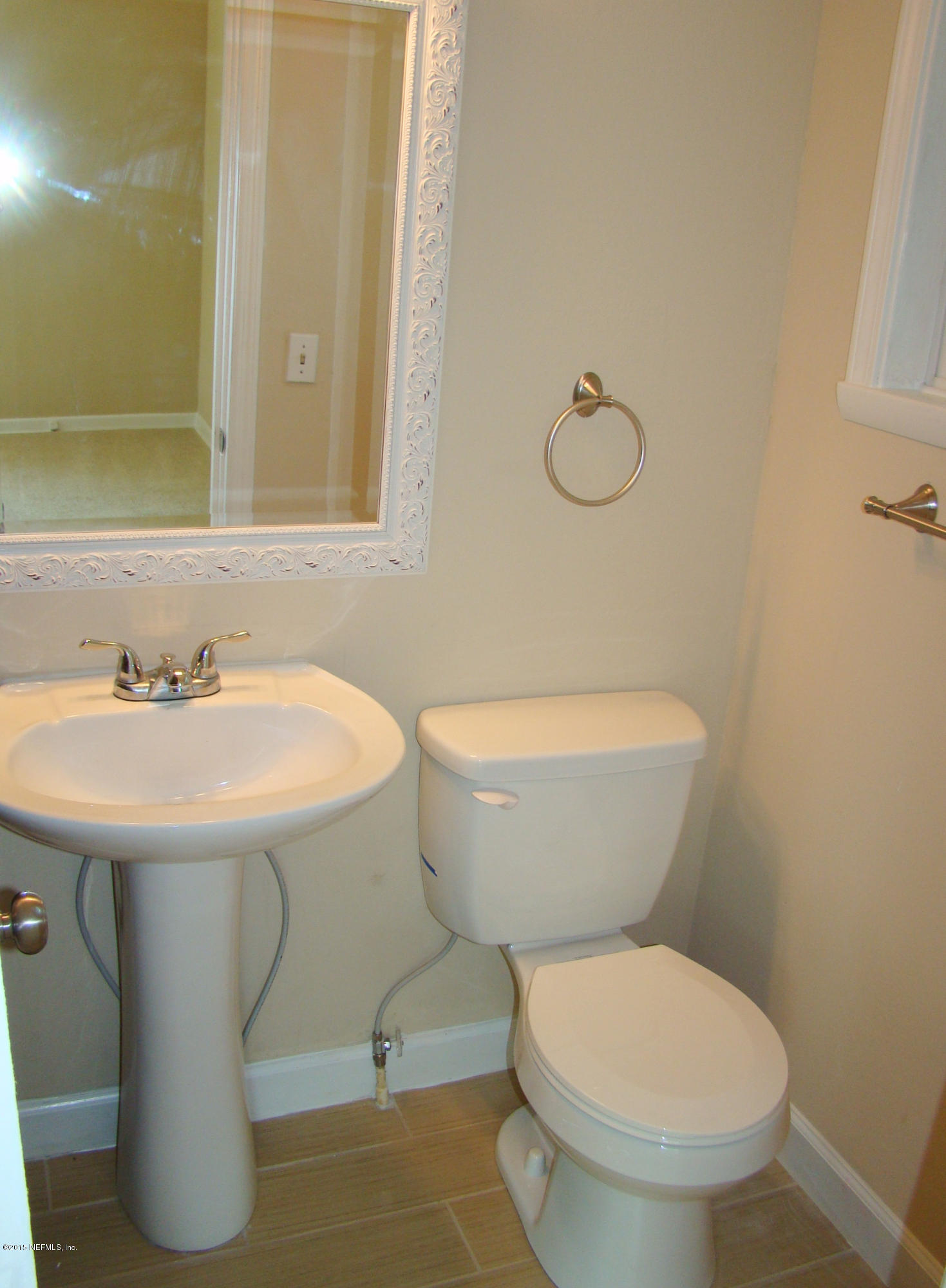 6315 Temple Road Jacksonville, FL 32217 - Photo 6 of 12 a bathroom with a sink and a toilet