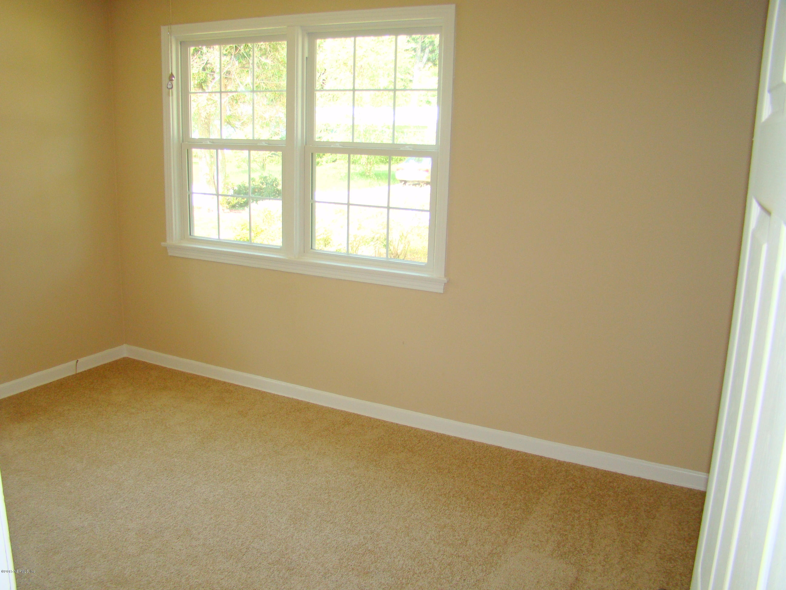 6315 Temple Road Jacksonville, FL 32217 - Photo 9 of 12 an empty room with a window