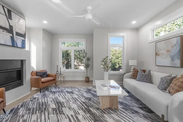 a living room with furniture and a fireplace