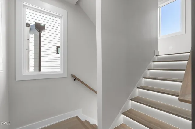 a view of a hallway view with staircase