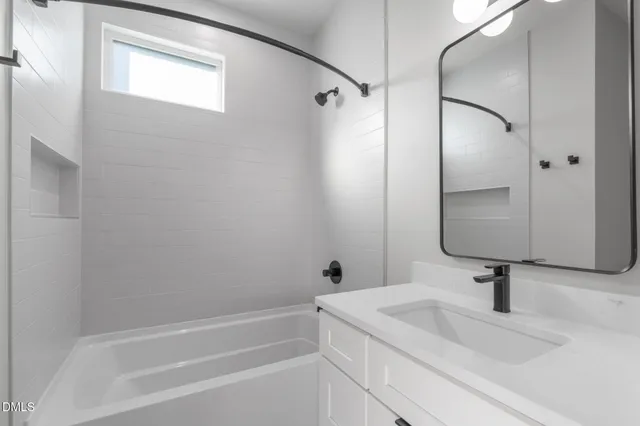 a view of a hallway with a livingroom and a corridor