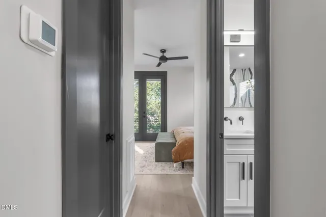 a bedroom with a large bed and a large window