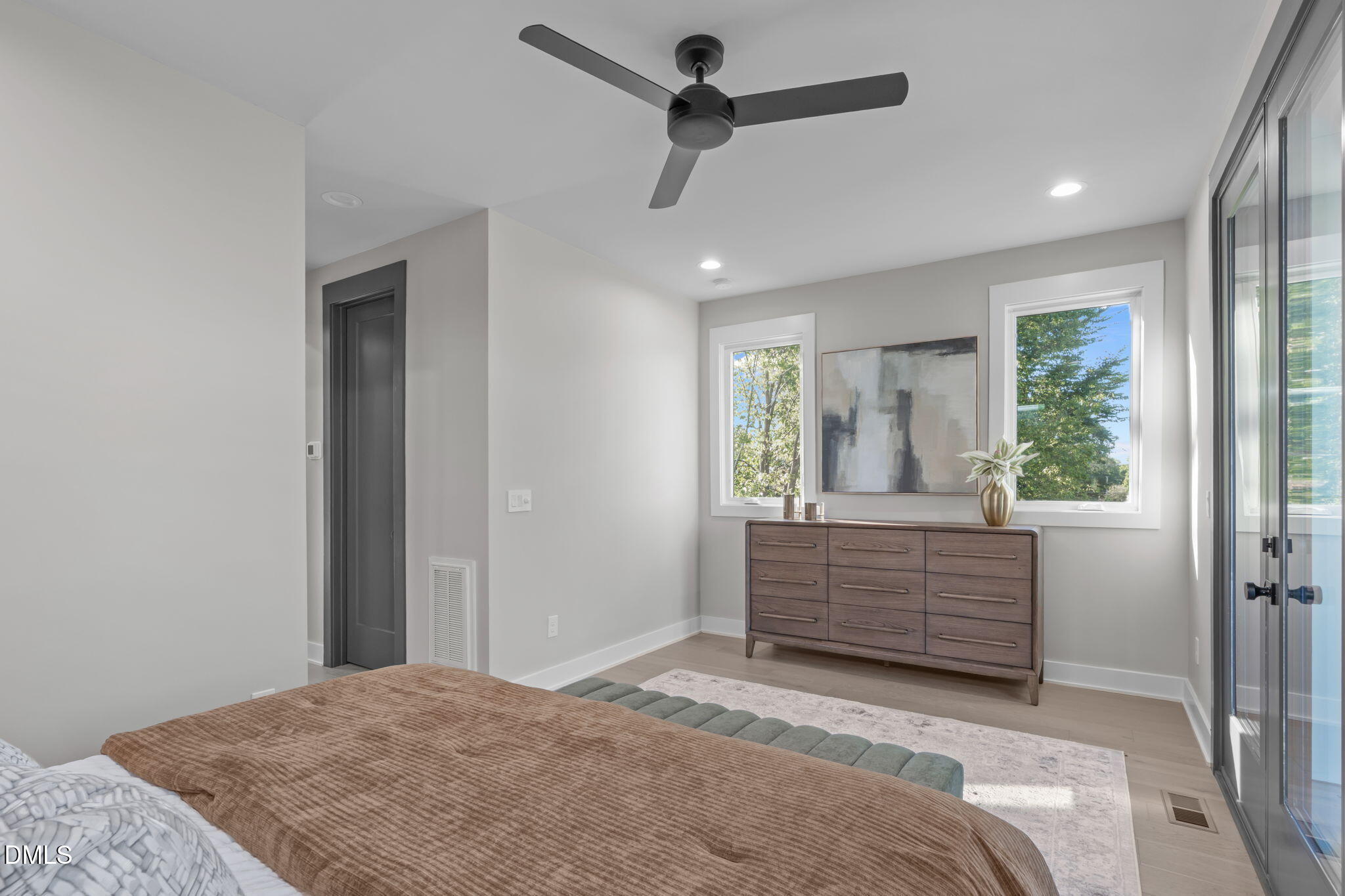 228 Woodsborough Place Raleigh, NC 27601 - Photo 27 of 59 a bedroom with a bed and a dresser