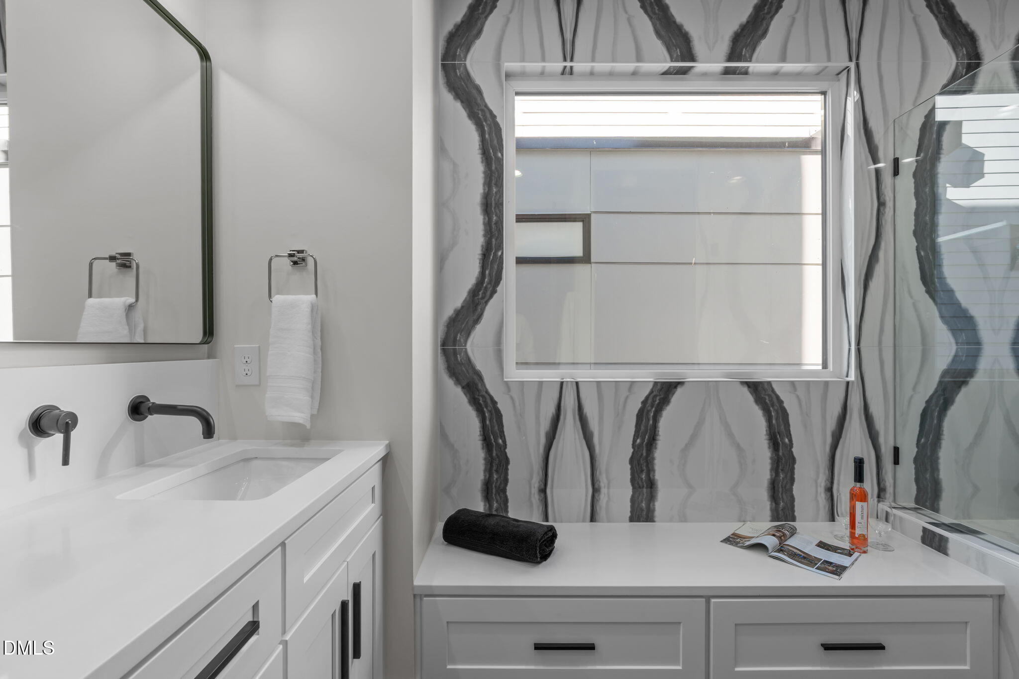 228 Woodsborough Place Raleigh, NC 27601 - Photo 30 of 59 a bathroom with a sink and a mirror