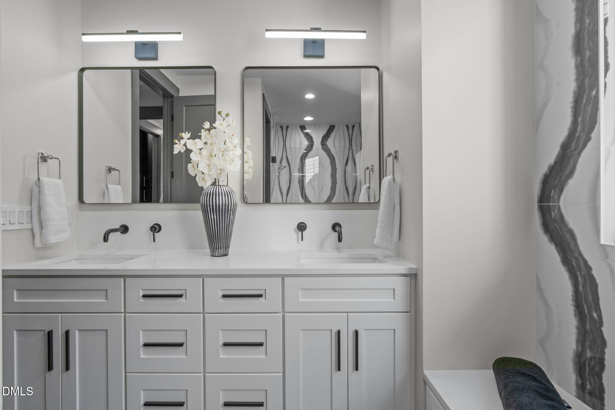 228 Woodsborough Place Raleigh, NC 27601 - Photo 32 of 59 a bathroom with a double vanity sink mirror and