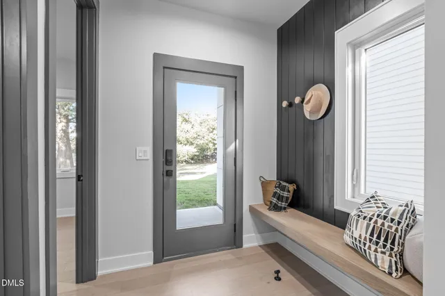 an empty room with windows and closet