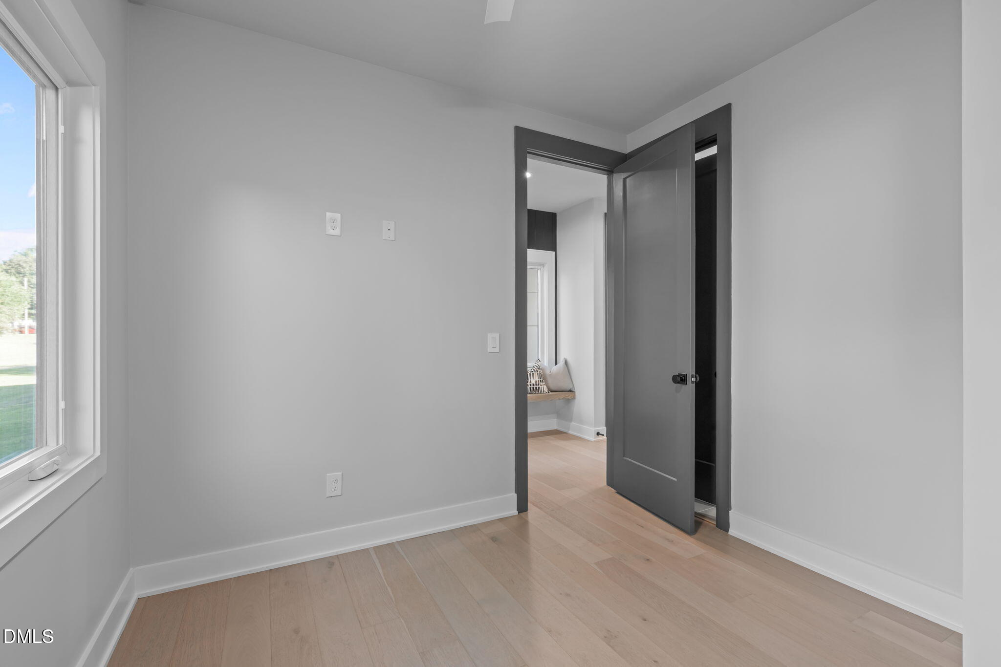 228 Woodsborough Place Raleigh, NC 27601 - Photo 38 of 59 an empty room with windows and closet