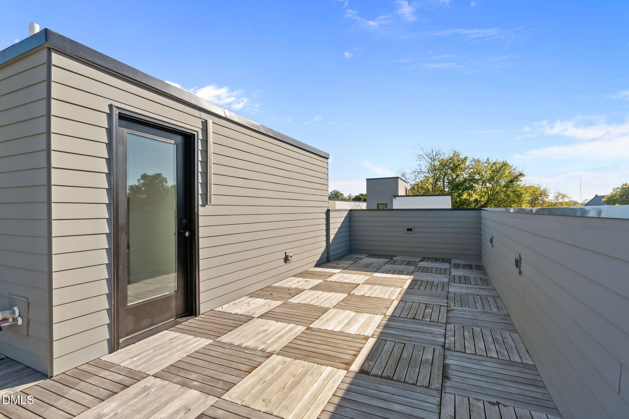 228 Woodsborough Place Raleigh, NC 27601 - Photo 39 of 59 a backyard of a house with wooden floor and fence
