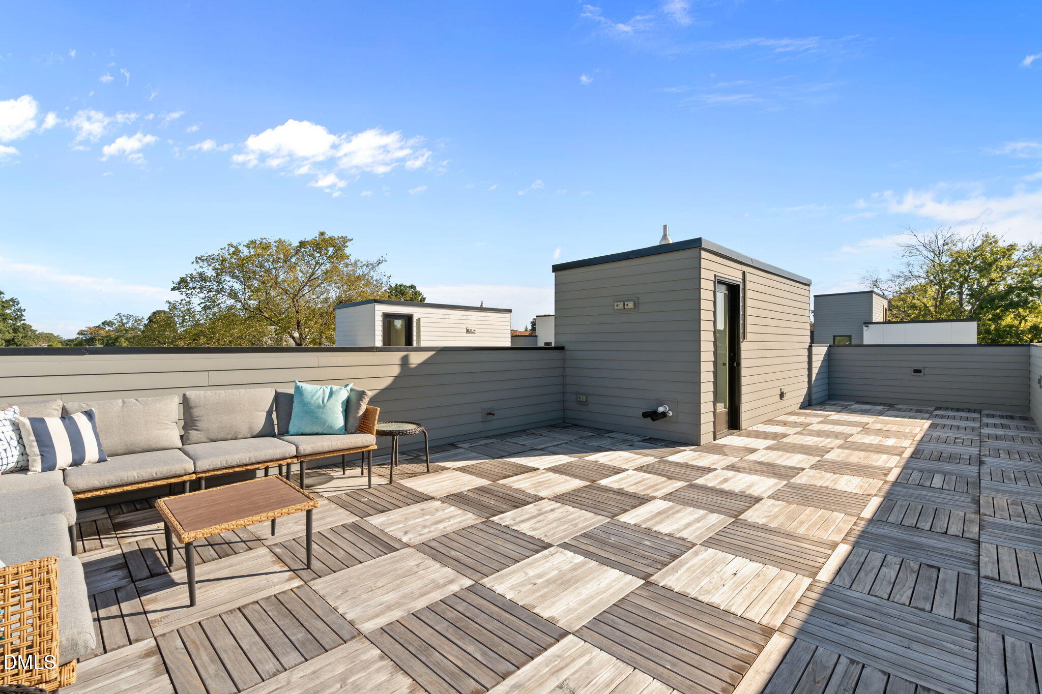 228 Woodsborough Place Raleigh, NC 27601 - Photo 41 of 59 a terrace of a house with outdoor seating