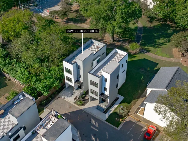 an aerial view of a house with outdoor space