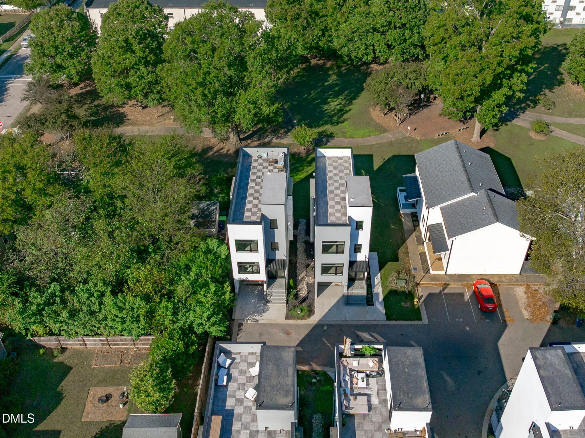 228 Woodsborough Place Raleigh, NC 27601 - Photo 48 of 59 an aerial view of multiple houses with yard