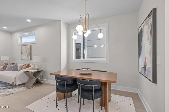 a view of a dining room with furniture and window