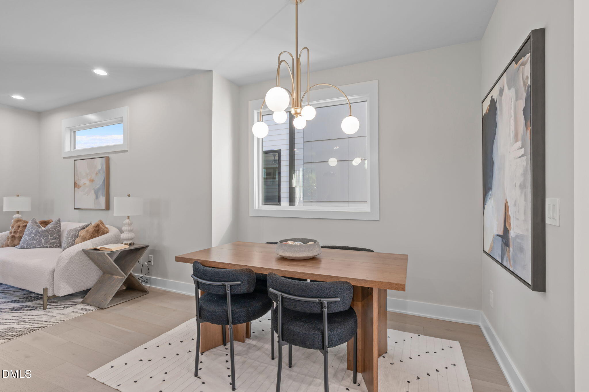 228 Woodsborough Place Raleigh, NC 27601 - Photo 4 of 59 a view of a dining room with furniture and chandelier