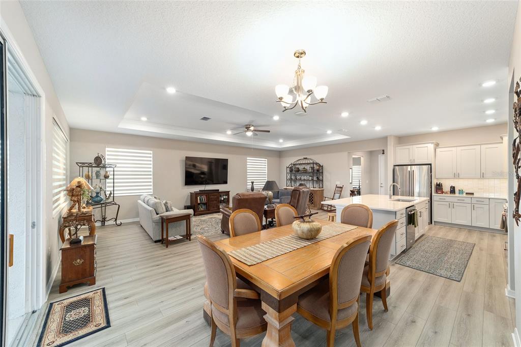 10691 Southwest 99th Place Ocala, FL 34481 - Photo 13 of 52 a view of a dining room with furniture window and wooden floor