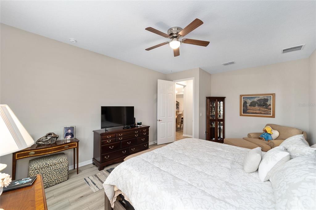 10691 Southwest 99th Place Ocala, FL 34481 - Photo 22 of 52 a bedroom with a bed and a flat screen tv