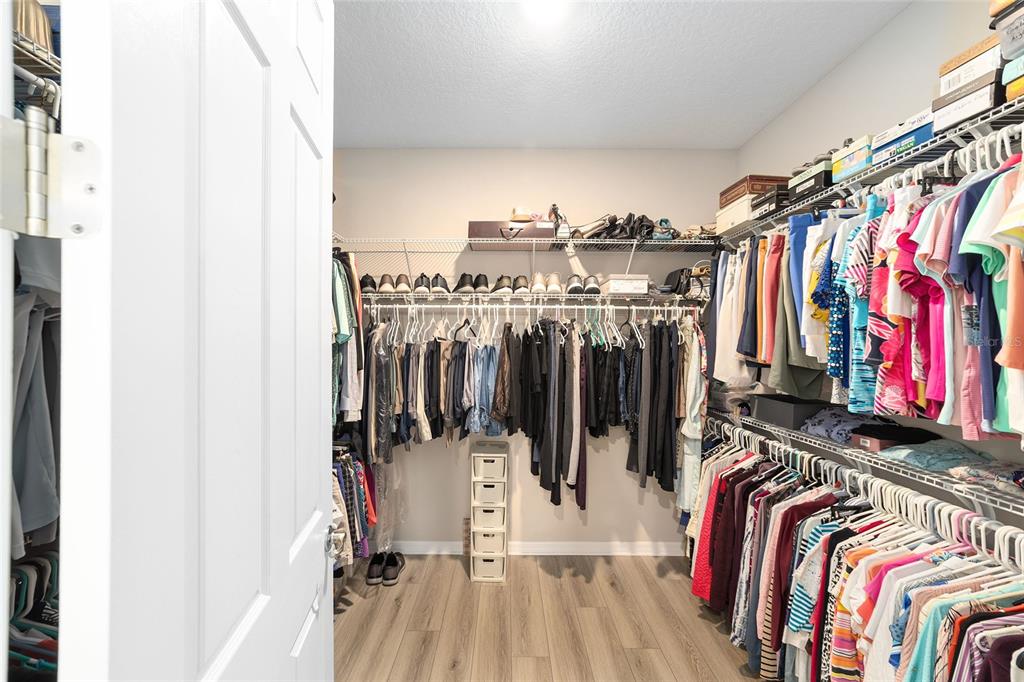 10691 Southwest 99th Place Ocala, FL 34481 - Photo 26 of 52 a view of walk in closet with clothes