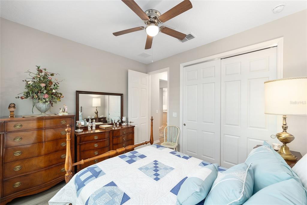 10691 Southwest 99th Place Ocala, FL 34481 - Photo 32 of 52 a bed room with a bed and a dresser