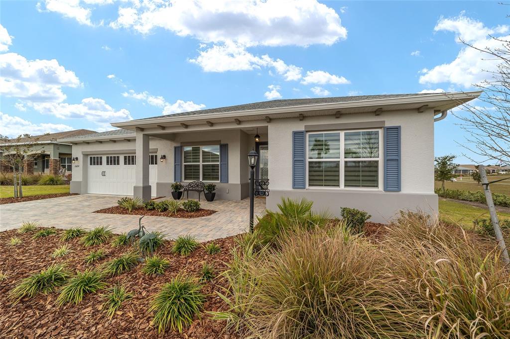 10691 Southwest 99th Place Ocala, FL 34481 - Photo 42 of 52 front view of a house with a patio