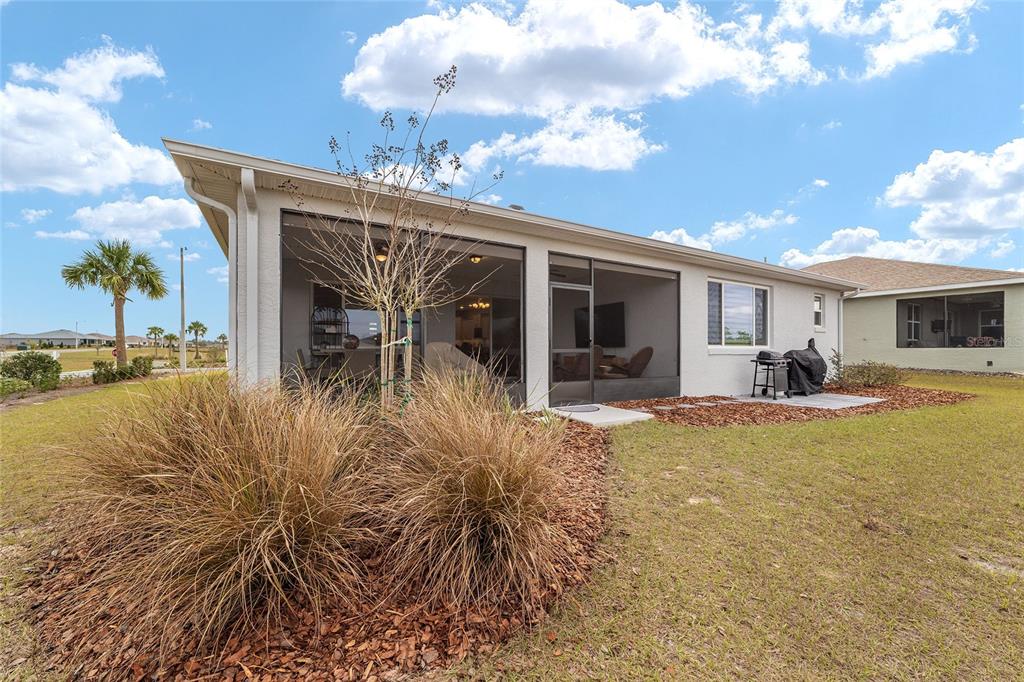 10691 Southwest 99th Place Ocala, FL 34481 - Photo 48 of 52 a view of a patio with table and chairs and potted plants