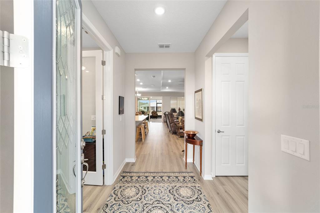 10691 Southwest 99th Place Ocala, FL 34481 - Photo 5 of 52 a view of a hallway with a livingroom and furniture
