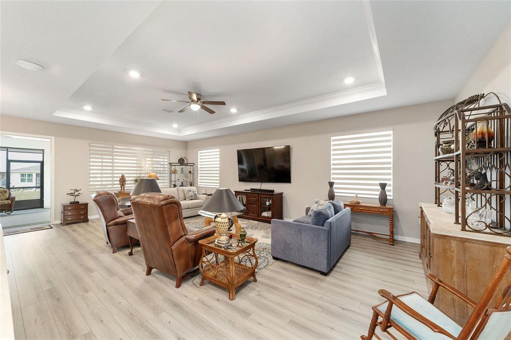 10691 Southwest 99th Place Ocala, FL 34481 - Photo 7 of 52 a living room with furniture and a flat screen tv