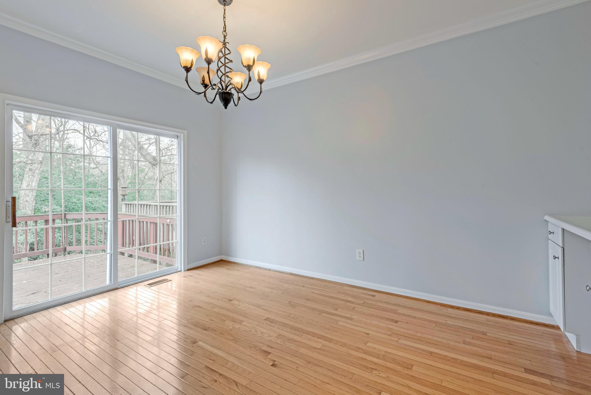 226 Wintergull Lane Annapolis, MD 21409 - Photo 15 of 38 a view of wooden floor and chandelier in a room