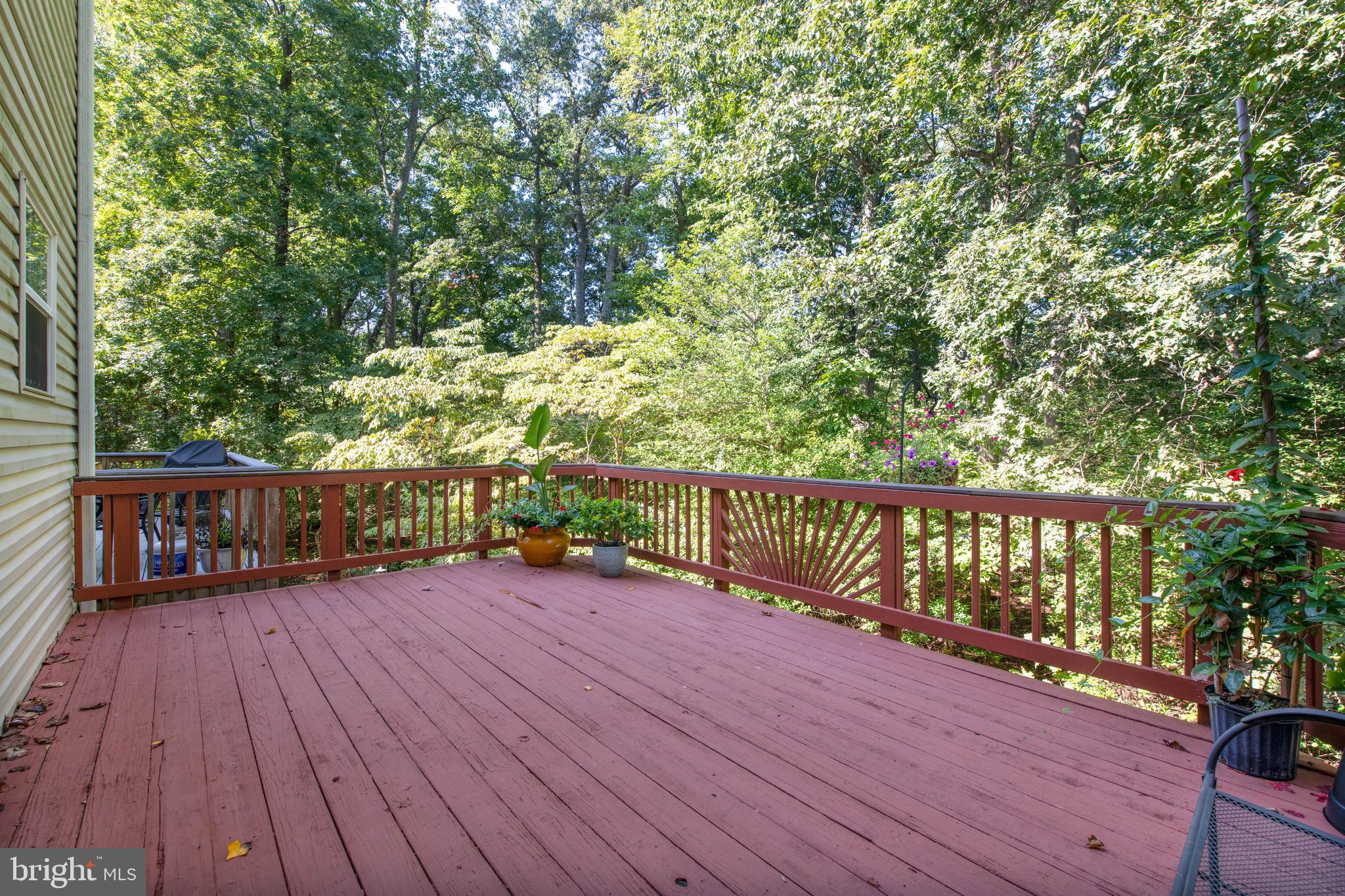 226 Wintergull Lane Annapolis, MD 21409 - Photo 16 of 38 a view of a balcony with wooden floor and fence