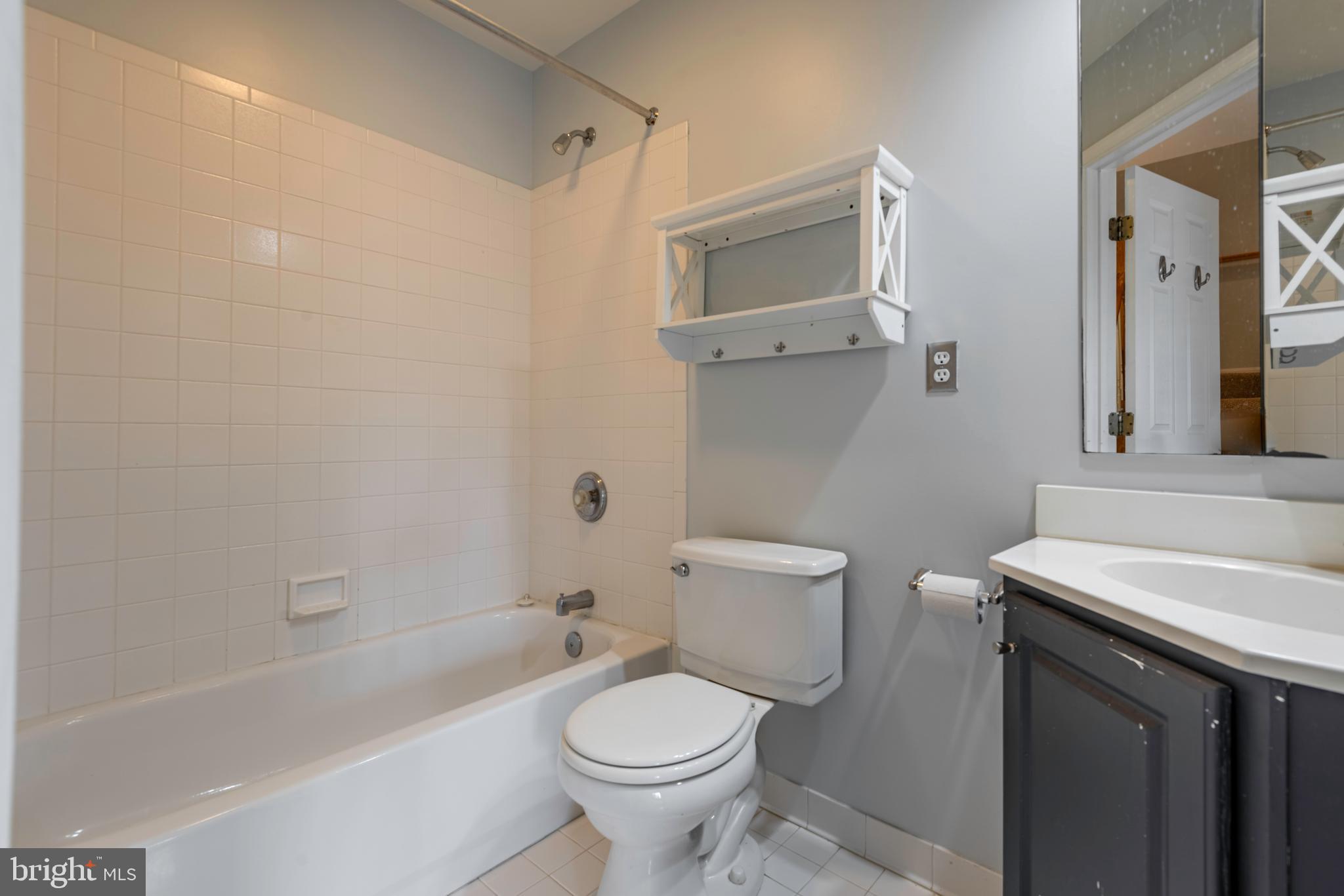 226 Wintergull Lane Annapolis, MD 21409 - Photo 26 of 38 a bathroom with a sink toilet and shower