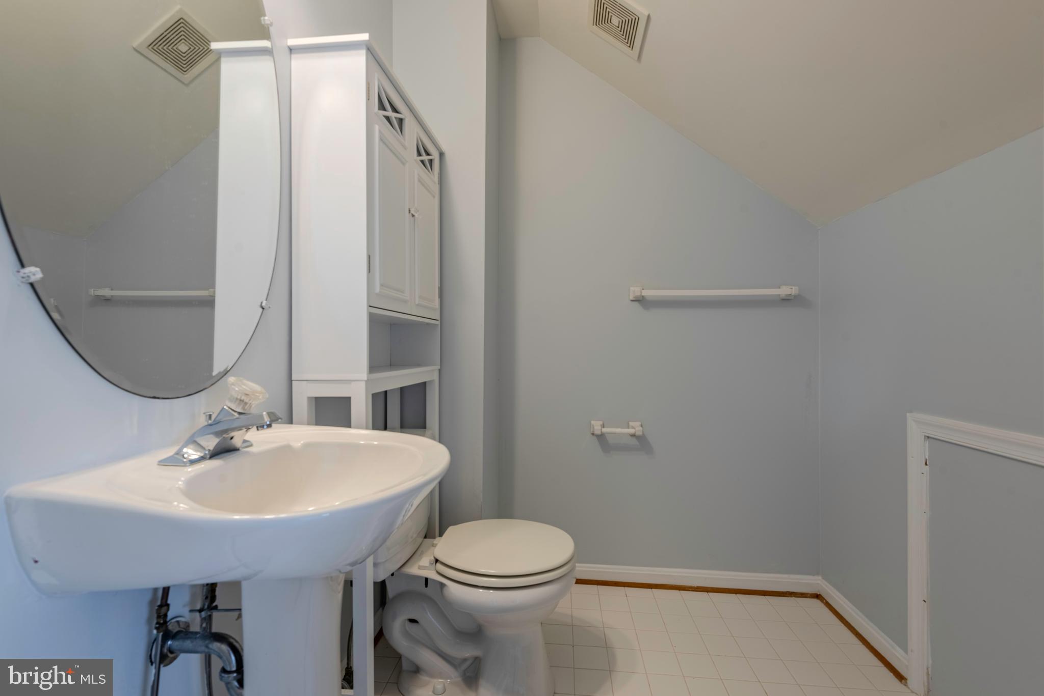 226 Wintergull Lane Annapolis, MD 21409 - Photo 32 of 38 a bathroom with a sink a toilet and a mirror