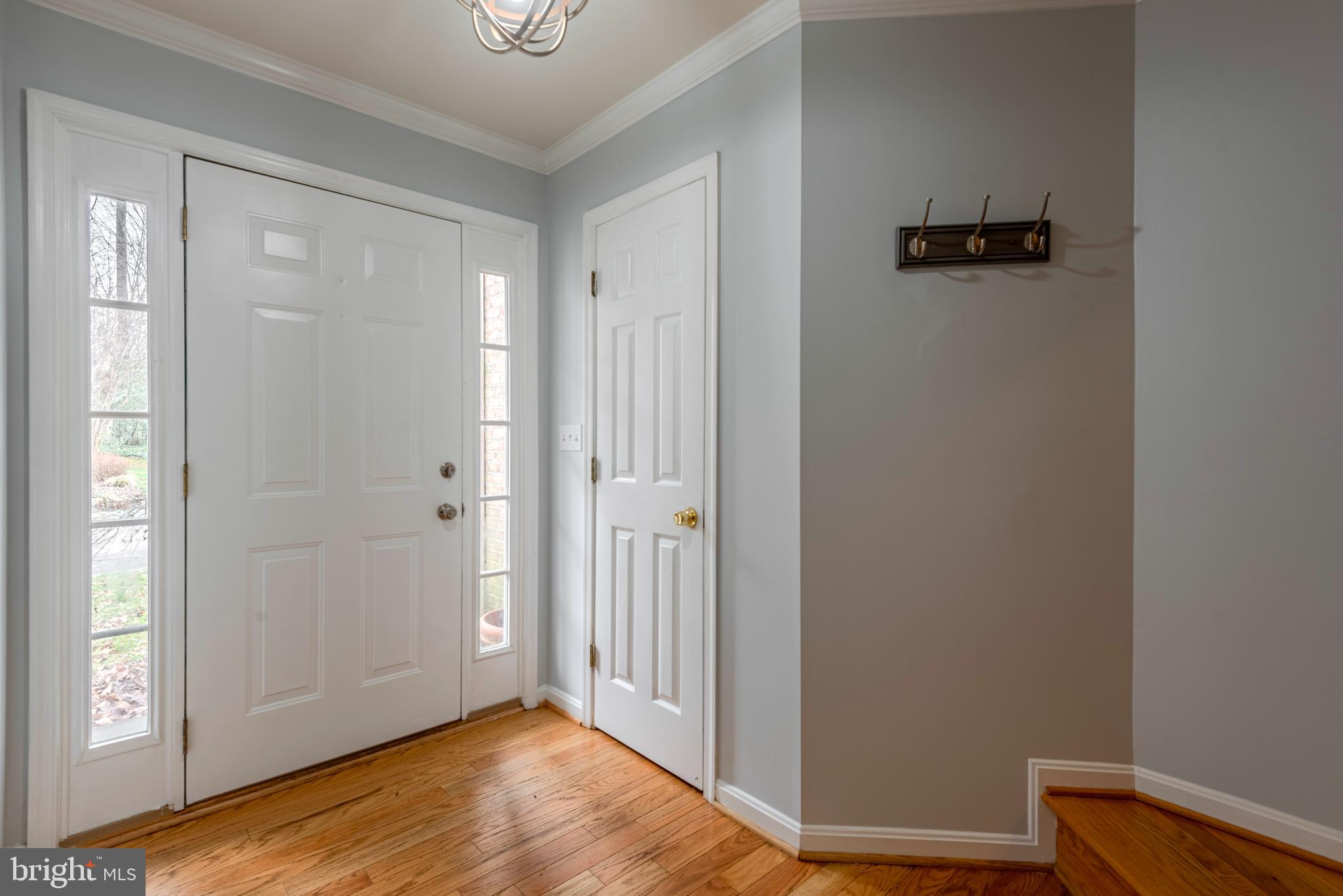 226 Wintergull Lane Annapolis, MD 21409 - Photo 4 of 38 a view of a hallway with wooden floor