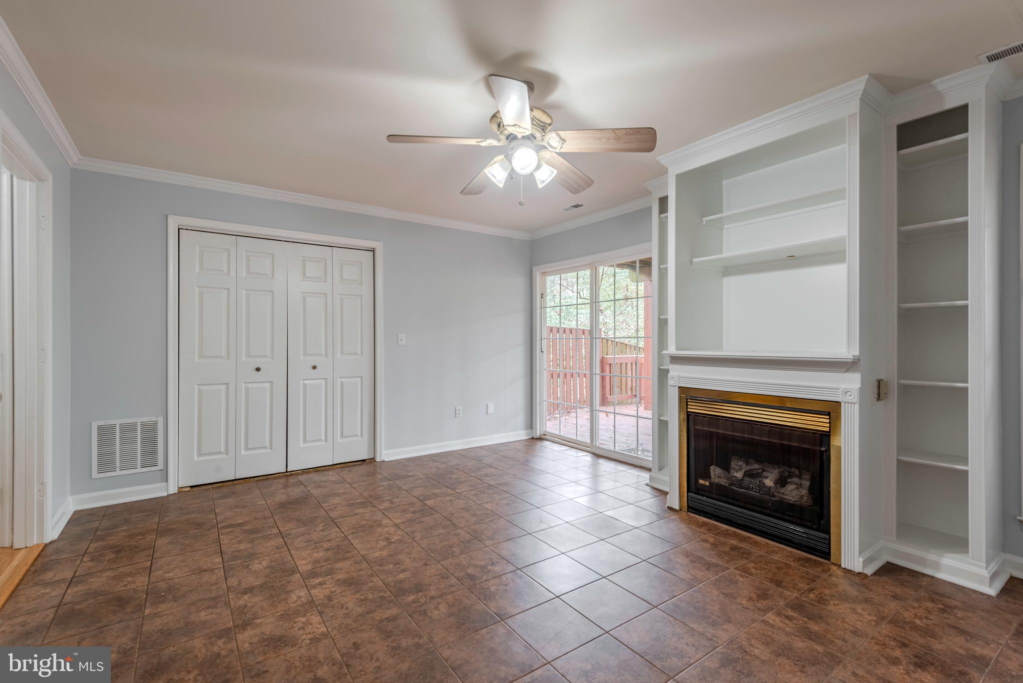 226 Wintergull Lane Annapolis, MD 21409 - Photo 6 of 38 a view of an empty room with fireplace and a window