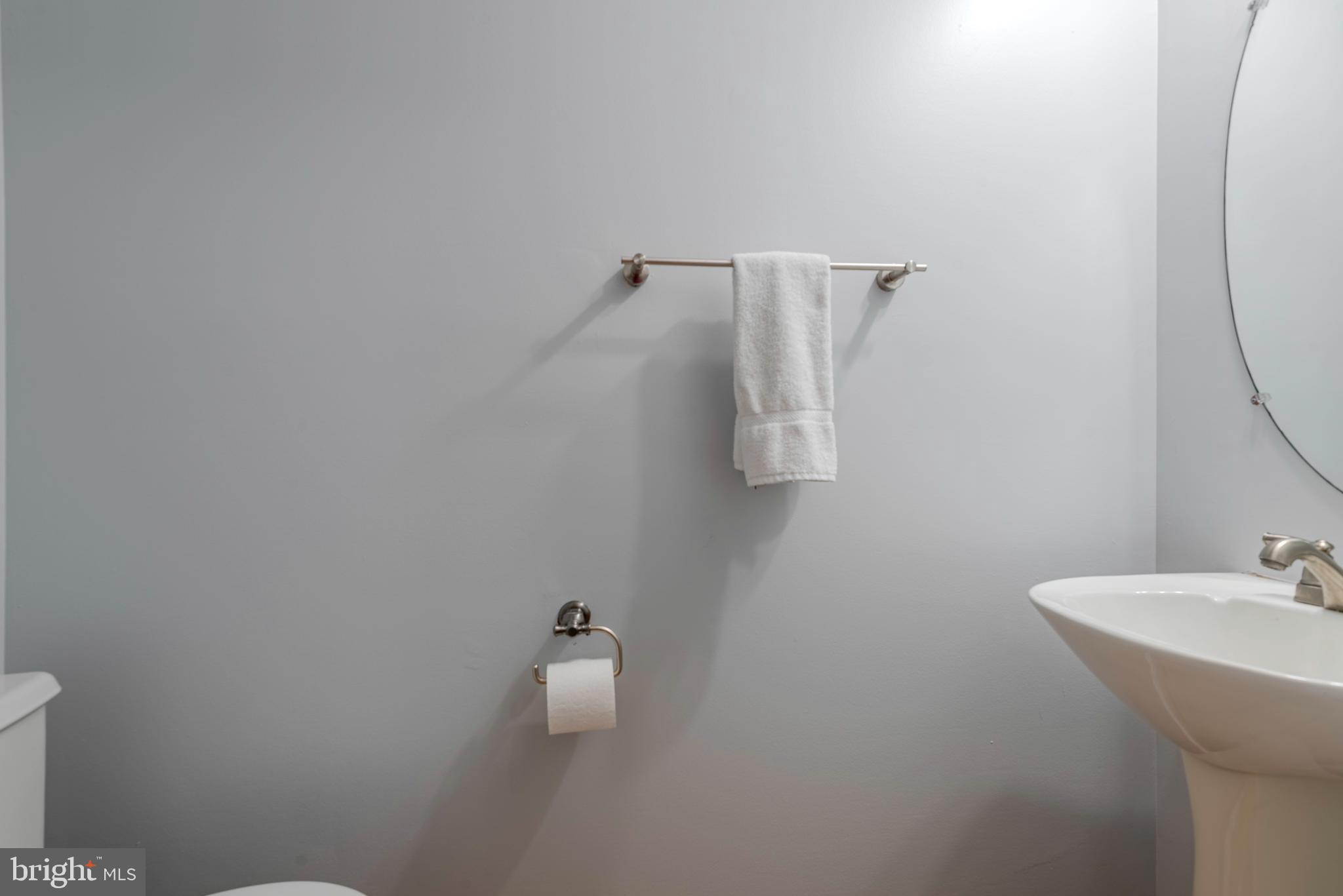 226 Wintergull Lane Annapolis, MD 21409 - Photo 8 of 38 a bathroom with a sink and mirror