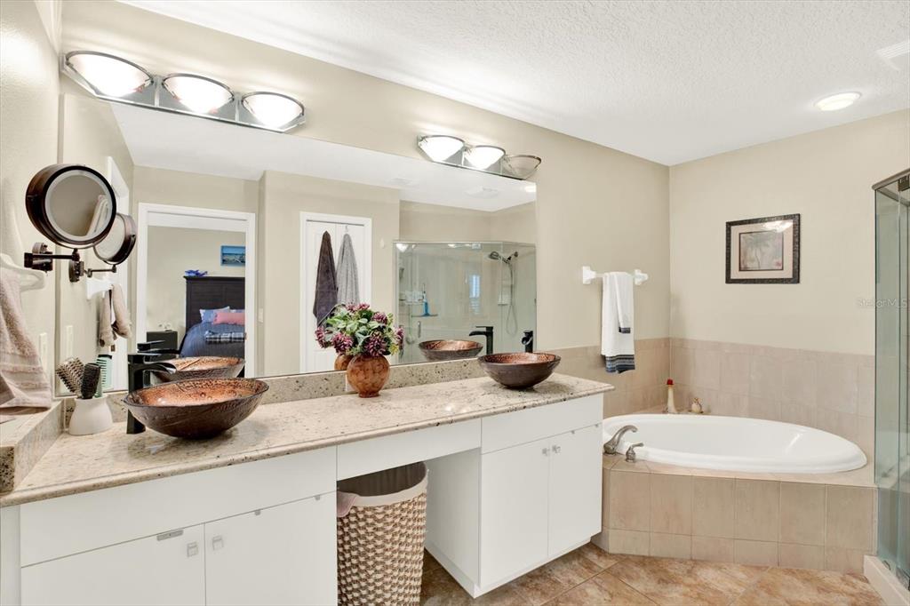 2021 Meadow Rue Court Trinity, FL 34655 - Photo 15 of 41 a bathroom with a double vanity sink and a mirror