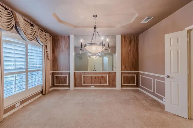 a view of a hallway with windows