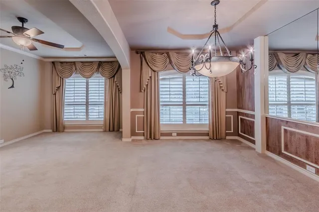 a view of empty room with wooden floor and fireplace