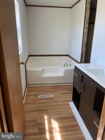 a bathroom with a bathtub and shower