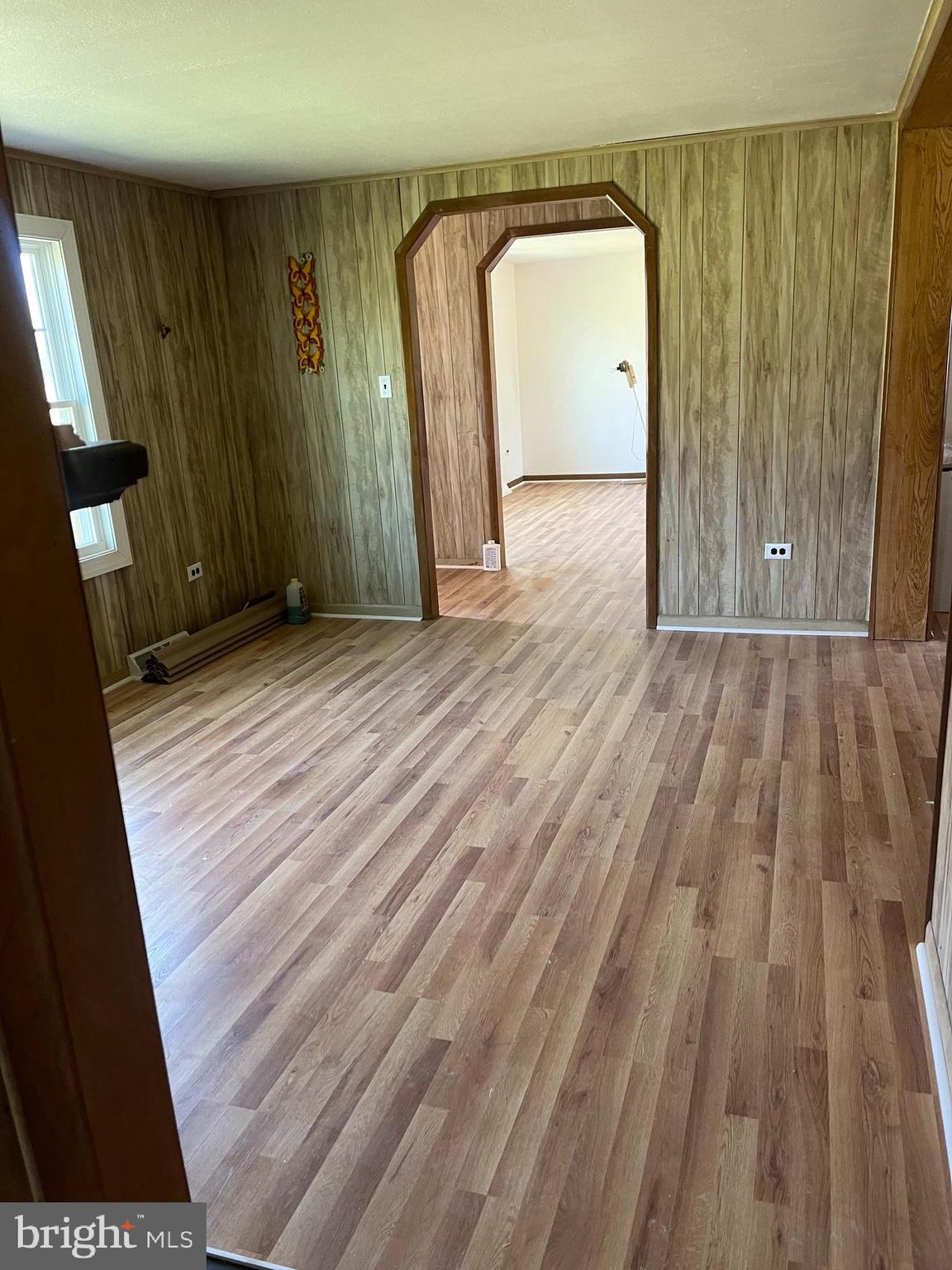 369 Ivey Creek Road Lancaster, VA 22503 - Photo 17 of 31 a view of a room with wooden floor and a window