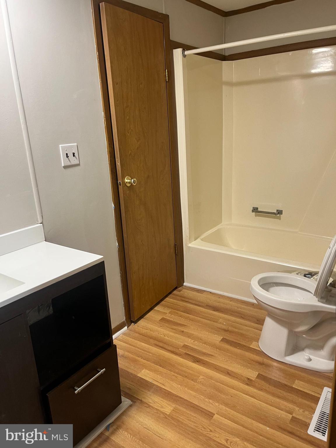 369 Ivey Creek Road Lancaster, VA 22503 - Photo 22 of 31 a bathroom with a sink a toilet a shower a vanity and a mirror