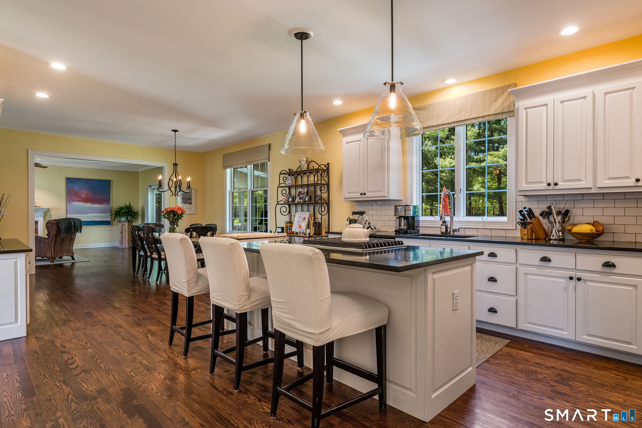170 Devonshire Lane Madison, CT 06443 - Photo 6 of 39 a kitchen with center island table and chairs